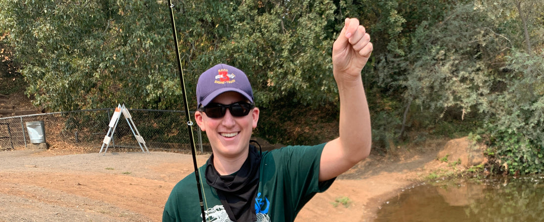 Joe Bendik holds his first fish on the fly, a monster sunfish, chosen as The Flyfish Journal's winning entry for the July Smolt of the Month contest.
