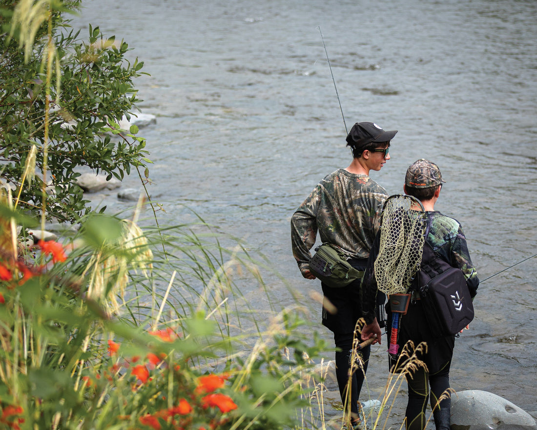 Jackson Donoghue and Arikinui Webber devising a plan of attack after sighting a good rising fish in the riffle. 