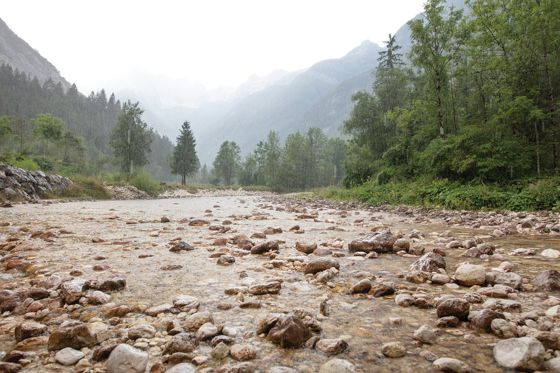August on the Soça River, Slovenia. A proper Balkan downpour, sky heading straight back into the river.