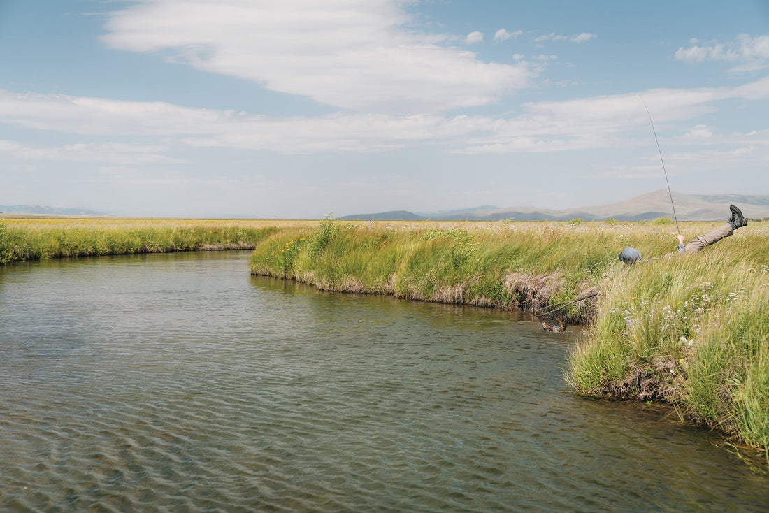 Southwest Montana, Karl Buck reaching for a fish. Photo: Jakob Burleson