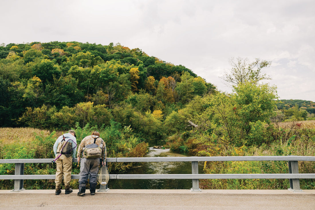 Chris Hart and P.J. Smith checking out the fish holding below a bridge on Tainter Creek, WI. Photo: Justin Carfagnini