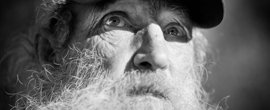 A black and white portrait of a flyfisherman.